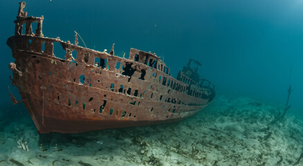 amazing sunken and rusty ship under the sea in the depths with good lighting and good resolution...