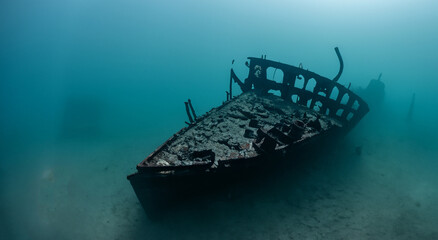 amazing sunken and rusty ship under the sea with good lighting in high resolution and sharpness