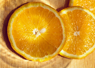 sliced juicy orange, close macrophotography of citrus