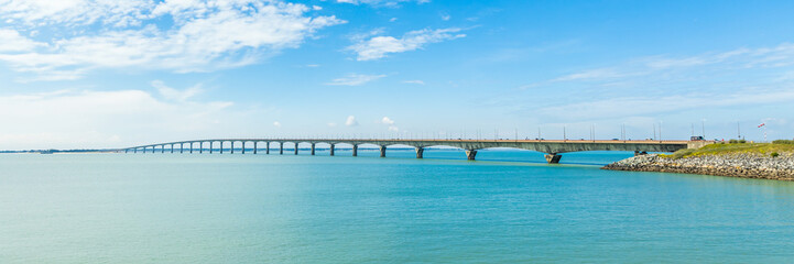 Fototapeta na wymiar Panoramic view of the Ile de Ré bridge seen from La Rochelle shore on a sunny day in Charente-Maritime, France