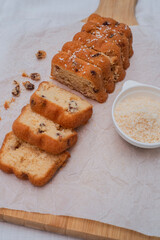 cake with raisins.the cake slices on a wooden kitchen board