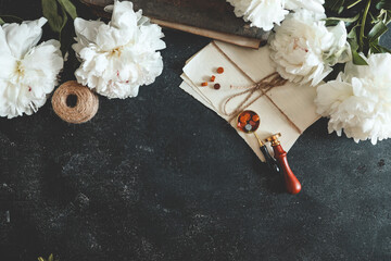 Summer background, flat lay layout, peonies and retro camera