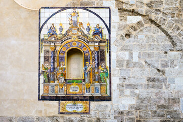 Medieval tile decoration in building walls, Valencia, Spain