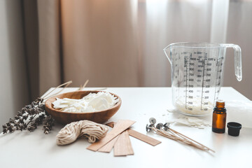 Set for crafting candle on white background. Eco soy wax and candle making tools. DIY candles. Hobby concept