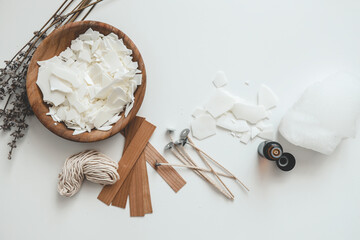 Set for crafting candle on white background. Eco soy wax and candle making tools. DIY candles. Hobby concept