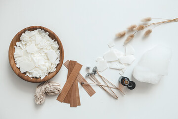 Set for crafting candle on white background. Eco soy wax and candle making tools top view, flat lay. DIY candles. Hobby concept