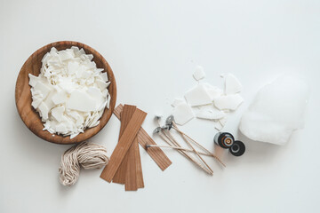 Set for crafting candle on white background. Eco soy wax and candle making tools top view, flat lay. DIY candles. Hobby concept