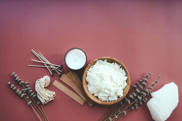 Candle making set and lavender on colorful background top view, flat lay