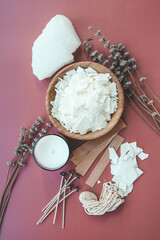 Candle making set and lavender on colorful background top view, flat lay
