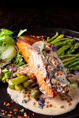 salmon steak with asparagus and salad
