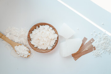 Set for crafting candle on white background. Eco soy wax and candle making tools top view, flat lay. DIY candles. Hobby concept