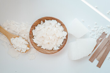 Set for crafting candle on white background. Eco soy wax and candle making tools top view, flat lay. DIY candles. Hobby concept