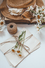 Letters in vintage style, daisies and a hat, summer flat lay