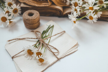 Letters in vintage style, daisies and a hat, summer flat lay