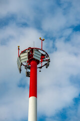 Fototapeta na wymiar Sightseeing tower on a background of blue sky with clouds.