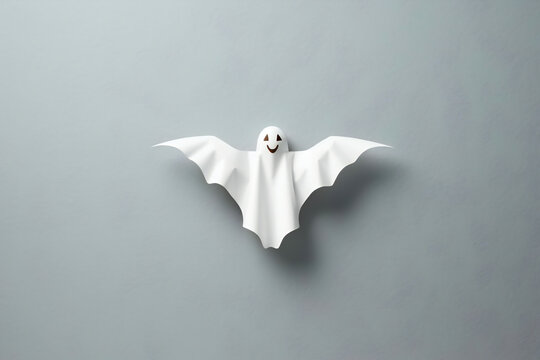black and white,   white goast Bat on gray background.  Halloween concept, copy space