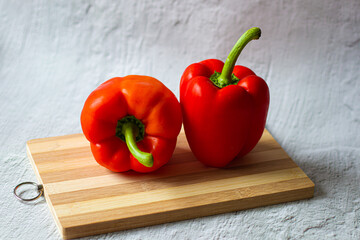 sweet peppers.still life of vegetables.vegetable shop.healthy vegetables.vitamins.red vegetables.vegetarianism.healthy food.cooking at home.hobby cooking.sweet bell pepper. paprika.close-up.quality