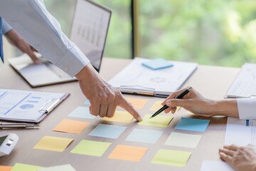 Business People brainstorming Meeting Design Ideas use post it notes to share idea professional investor start up project business brainstorming planning in office