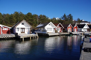 Fototapeta na wymiar Traditional Norwegian Wooden Houses overlooking the water. 