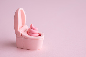 ピンクのウンチとトイレの便器　