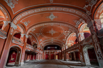 Fototapeta premium Exploring, Abandoned, Historic, Red, Cinema, Theatre, Miskolc, Hungary, Journey, Time, Culture, Forgotten, Architectural Gem, Heritage Site, Theatrical Splendor, Haunting Beauty, Time Capsule, Cultura