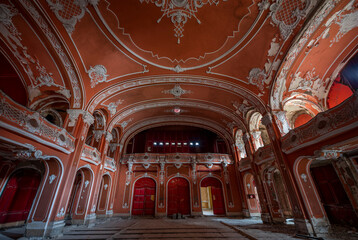 Fototapeta premium Exploring, Abandoned, Historic, Red, Cinema, Theatre, Miskolc, Hungary, Journey, Time, Culture, Forgotten, Architectural Gem, Heritage Site, Theatrical Splendor, Haunting Beauty, Time Capsule, Cultura