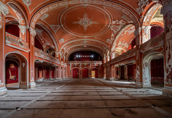 Fototapeta premium Exploring the Historic Abandoned Red Cinema and Abandoned Red Theatre in Miskolc, HungaryJourney Through Time and Culture