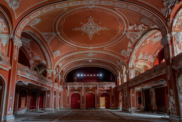 Obraz premium Exploring the Historic Abandoned Red Cinema and Abandoned Red Theatre in Miskolc, HungaryJourney Through Time and Culture