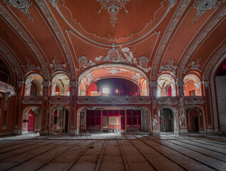 Obraz premium Exploring the Historic Abandoned Red Cinema and Abandoned Red Theatre in Miskolc, HungaryJourney Through Time and Culture