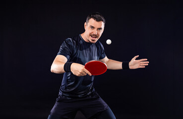 Table tennis player on the black background. Ping pong banner. Download a photo of a table tennis...