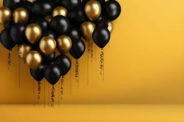 Poster Golden and black shiny balloons with copy space on yellow plain background, balloons banner backdrop © Delights