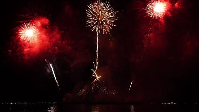 Real fireworks background. Firework Display,  abstract blur of real golden shining fireworks lights at night sky. glowing fireworks show. Firework  Explosive Material. New year's eve fireworks 