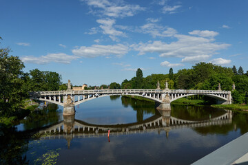 Fototapeta premium Nymburk, Czech Republic - May 30, 2023 - the road bridge in Nymburk carries the road over the Elbe, on a sunny spring afternoon 
