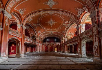 Fototapeta premium Exploring the Historic Abandoned Red Cinema and Abandoned Red Theatre in Miskolc, HungaryJourney Through Time and Culture