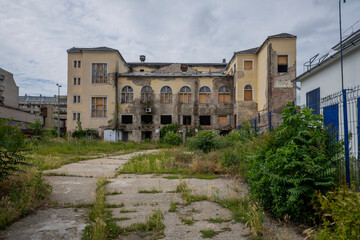 Obraz premium Exploring the Historic Abandoned Red Cinema and Abandoned Red Theatre in Miskolc, HungaryJourney Through Time and Culture