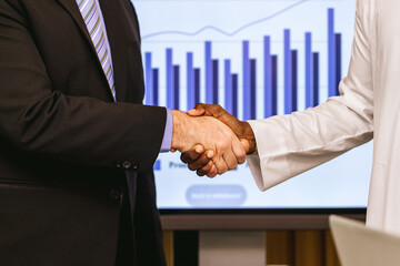 Business people shaking hands. Businessman shaking hands during a meeting in the office. handshake and business people concepts. Two people shaking hands