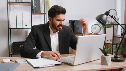 Conflict Quarrel Negotiation. Angry businessman ceo making webcam laptop online video call at...