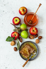 Honey, apple, honey comb , table set with traditional food for Jewish New Year Holiday, Rosh Hashana	