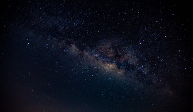 Panorama blue night sky milky way and star on dark background.Universe filled with stars, nebula and galaxy with noise and grain.Photo by long exposure and select white balance.selection focus.amazing © Mohwet
