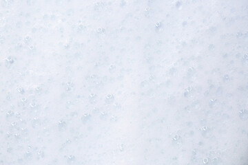 Soap foam close-up as a background. Facial cleanser foam bubbles. A foam party.