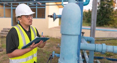 Environmental engineers work at wastewater treatment plants,Male plumber technician working at water supply