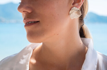 Gentle lifestyle female portrait, close up. Tropical summer mood.