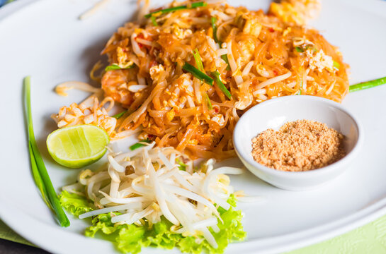 Traditional Thai dish noodles with seafood with beans on a plate