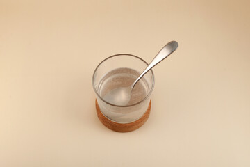 Glass of Xanthan gum dissolved in water, top view. Food additive E415. Stabiliser and Thickener. Mixture is widely used in food industry for thickening gluten-free products, pastries and beverages