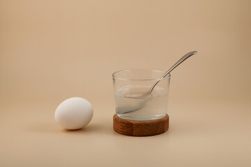 White color egg and Water soluble Xanthan gum in glass. Xanthan gum is often used in dietary...
