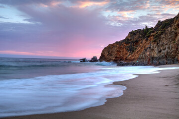 Sunset over the beach at Crescent Bay in Laguna Beach, California, USA in summer
