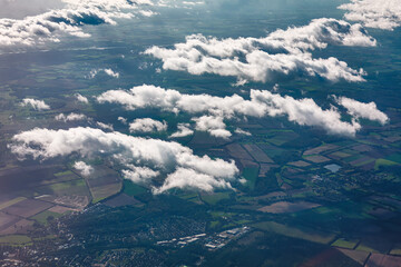 Aerial view of clouds and meadows in England, UK . White clouds over the Earth 