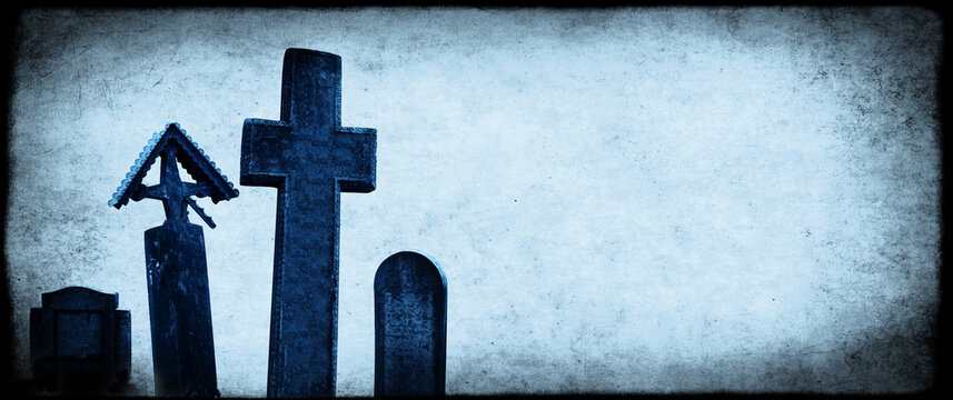 Halloween banner with old paper texture and medieval stone crosses, tombstones in a cemetery. Toned in blue color. Copy space for your text