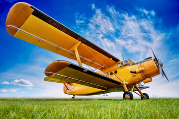 historic biplane against a cloudy sky © Designpics