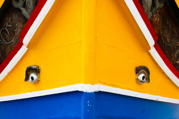 Colourful Luzzu fishing boat close up showing the eyes of Horus, an old tradition of Malta. 